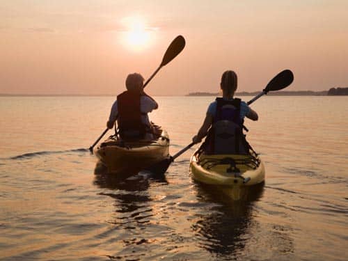Man and woman kayaking on a date